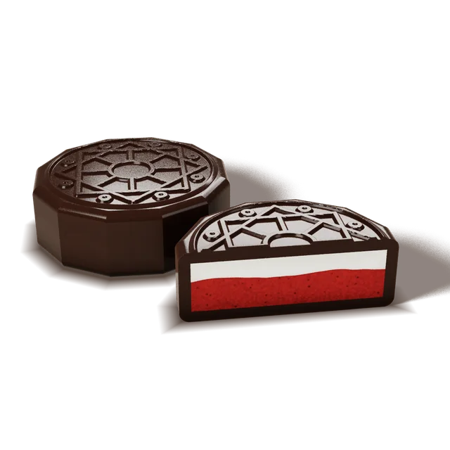 Red Velvet chocolate cut open to show red sponge and cream cheese ganache