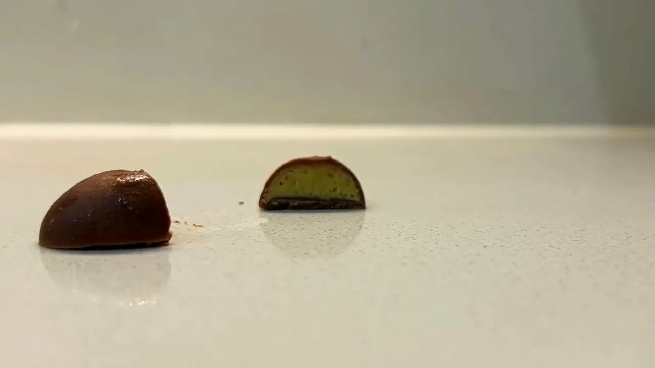 A chocolate cut in half